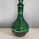 Old green carafe with ribbed lines