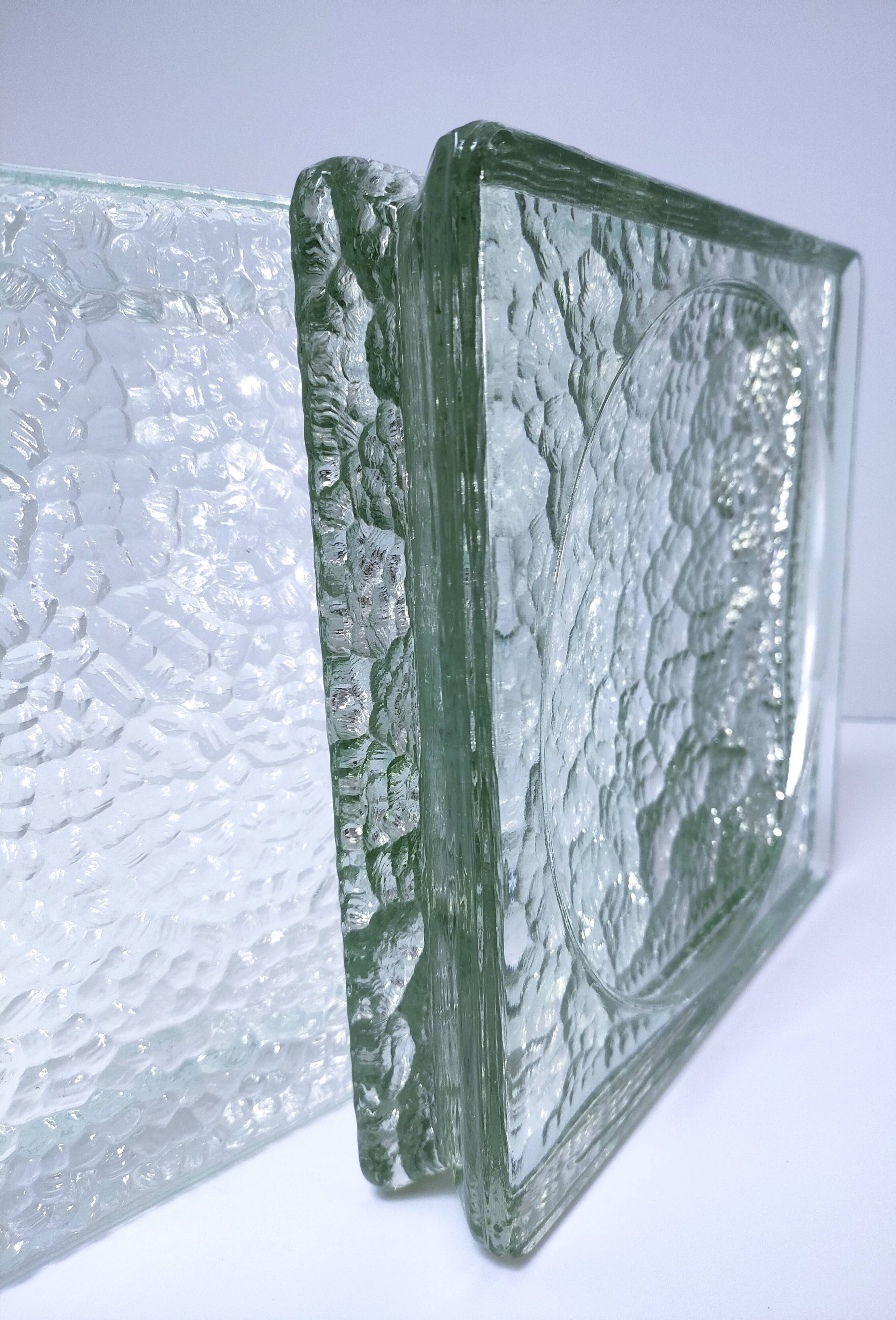 Two designer glass paving pockets