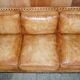 Three-seater leather canapé in Edwardian style with studs.