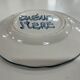 Painted and enamelled ceramic plate