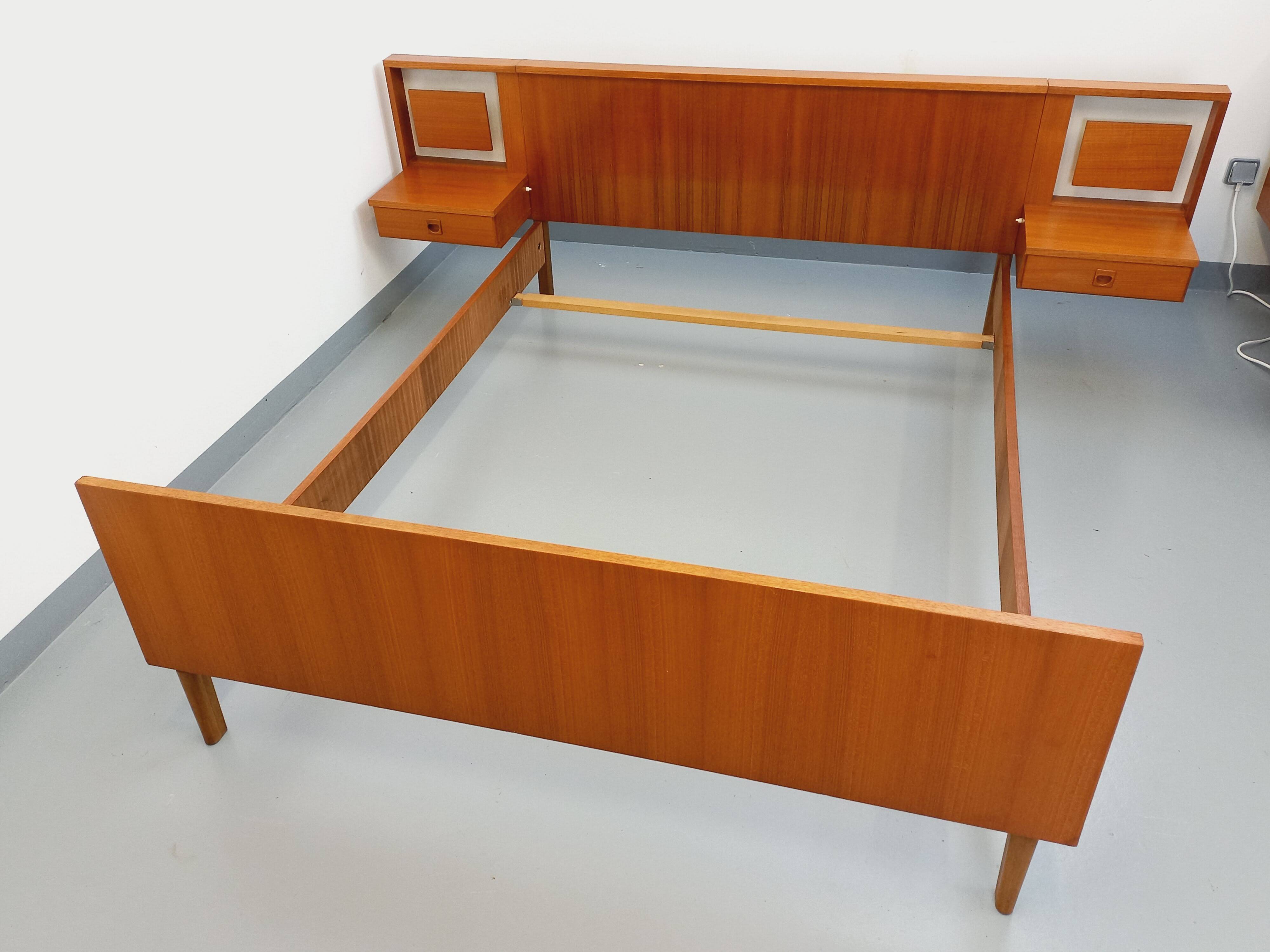 Vintage Scandinavian style double bed in teak from the 60s with integrated bedside lights