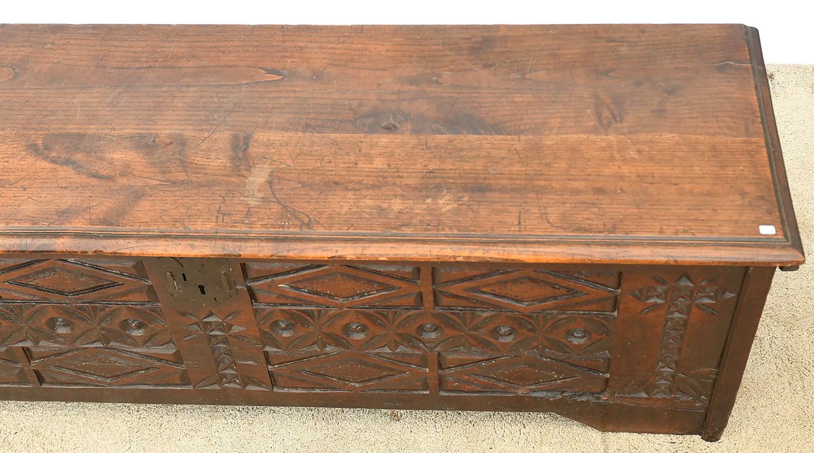 Antique chest in carved wood
