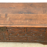 Antique chest in carved wood