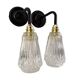 Set of two electrified chiseled glass sconces to nine