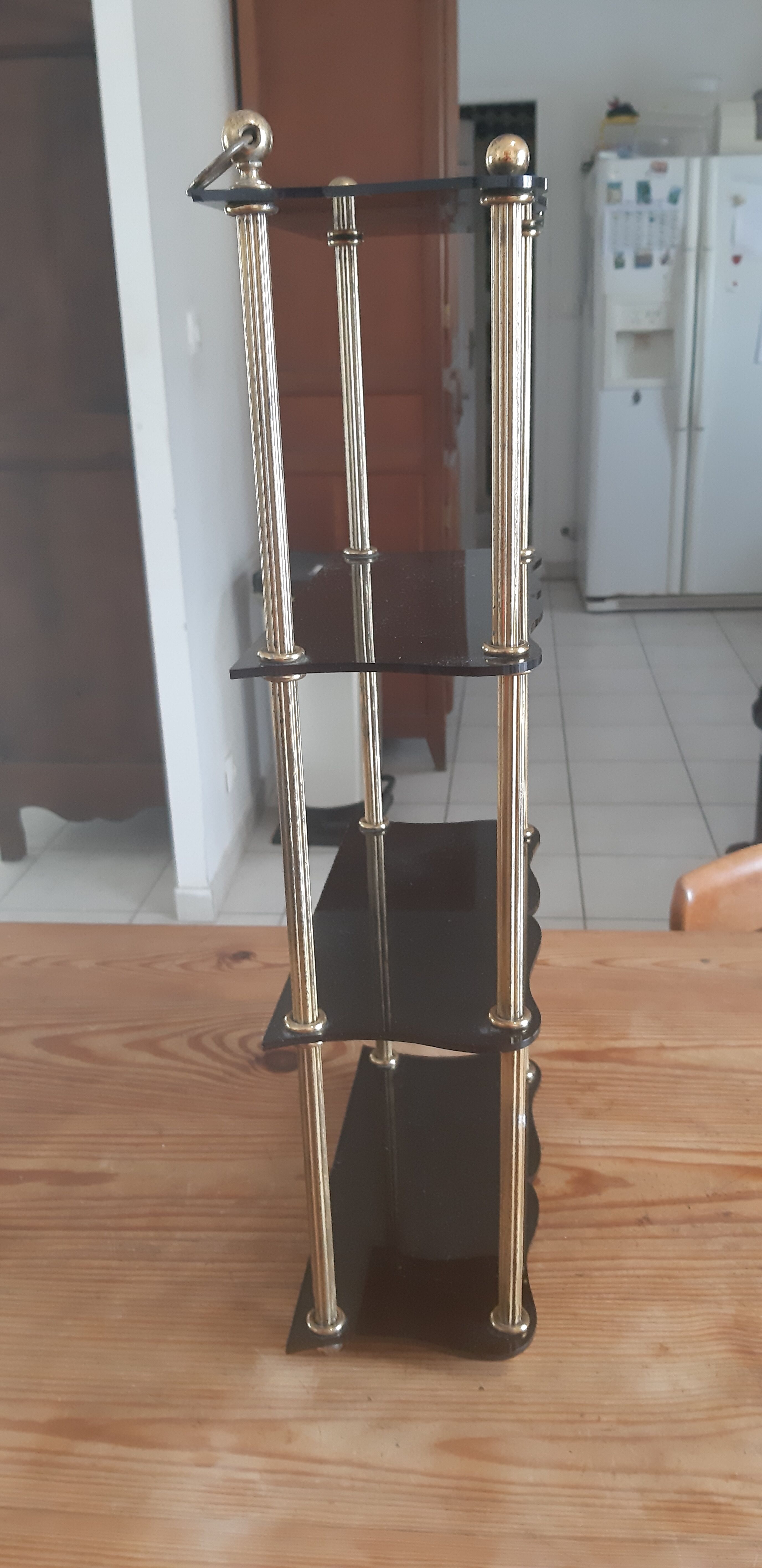 Vintage shelf of the 60s in golden metal and black plastic