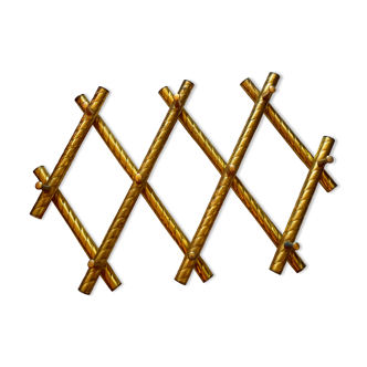 Wall coat rack in gilded metal