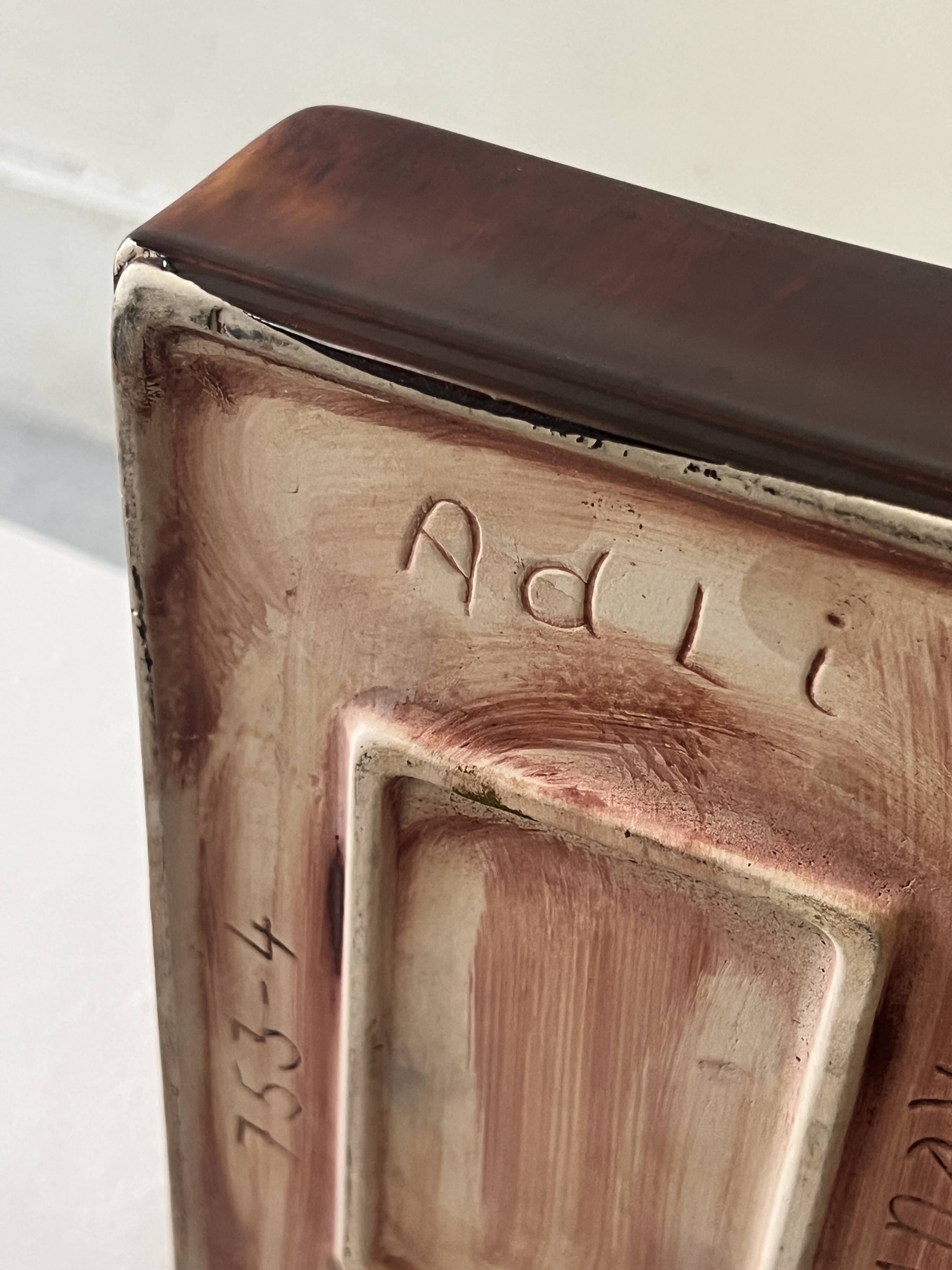 Bordeaux ceramic enamelled vide poche by Dutch artist A. Reuver, numbered.