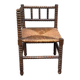 Brutalist corner chair in turned wood with straw bobbins, 1960.