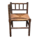 Brutalist corner chair in turned wood with straw bobbins, 1960.