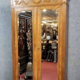 Armoire a miroirs style louis XVI en noyer a patine blonde vers 1880