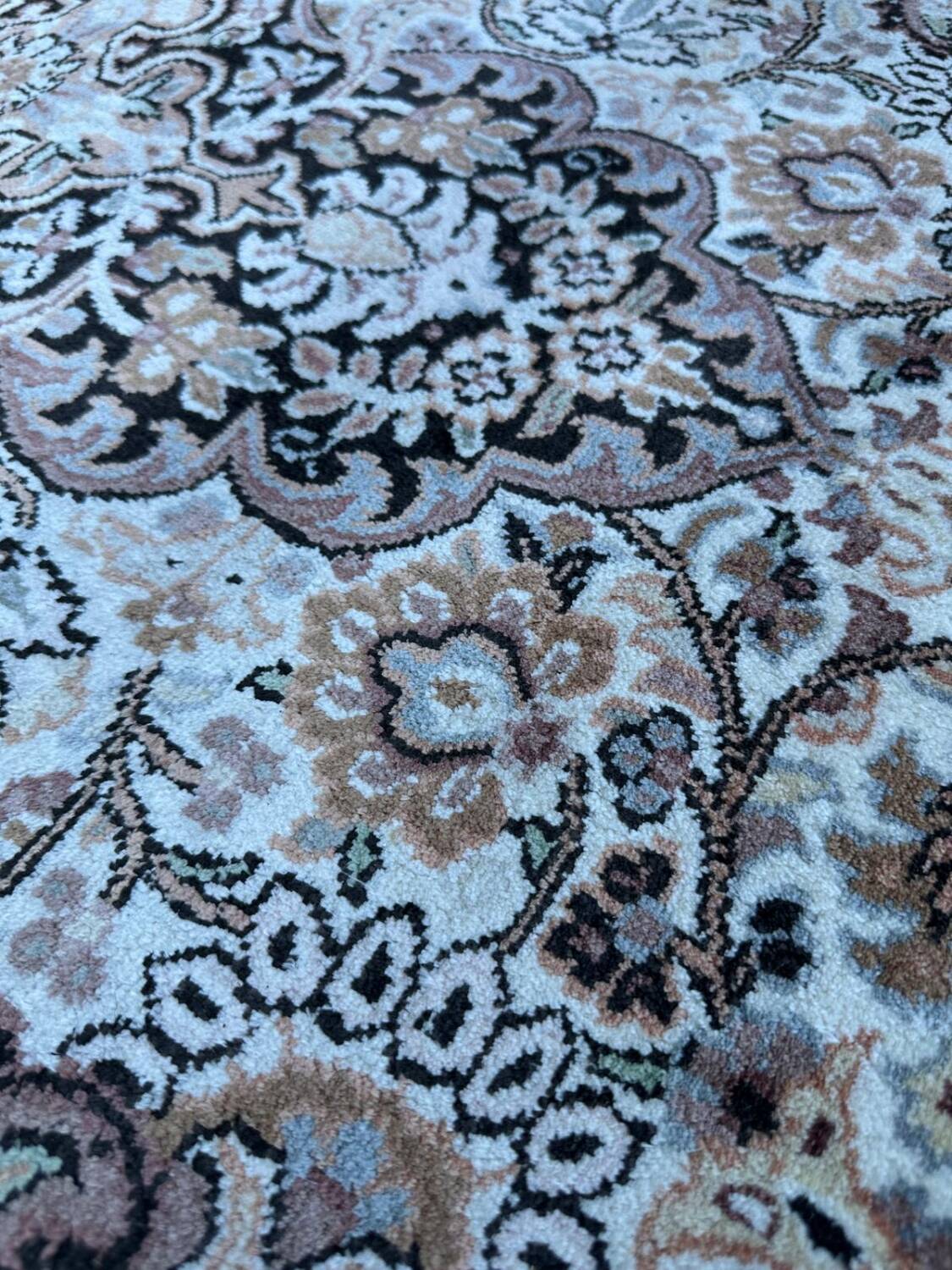 Hand-knotted Persian silk rug