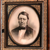 Black and gilded ebonite frame, wood and plaster 19th century