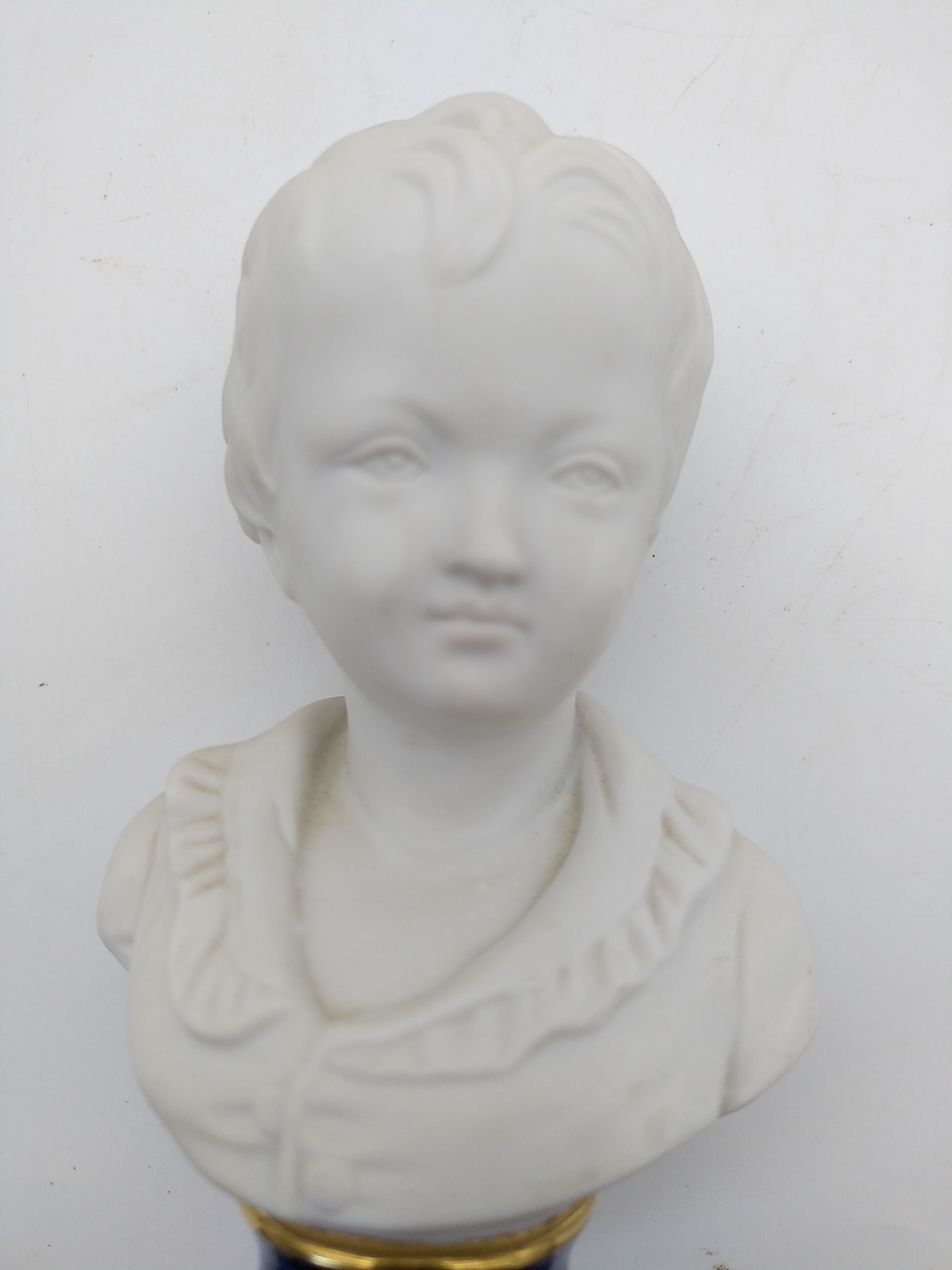 Child bust in biscuit. Capodimonte .