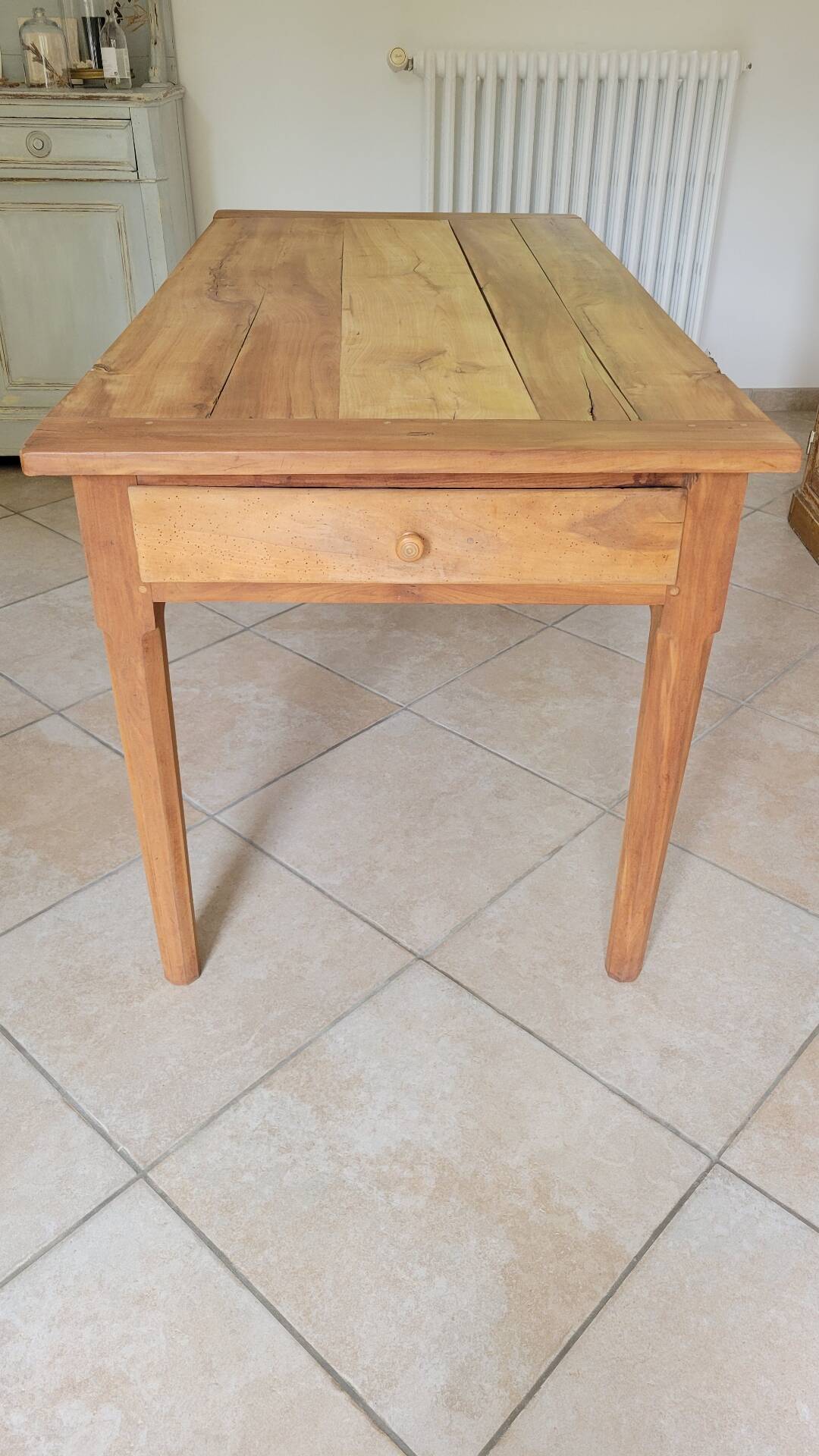 Old farmhouse table made of solid walnut wood.