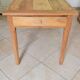 Old farmhouse table made of solid walnut wood.