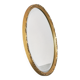 Oval mirror with gilded wood from the 1960s.