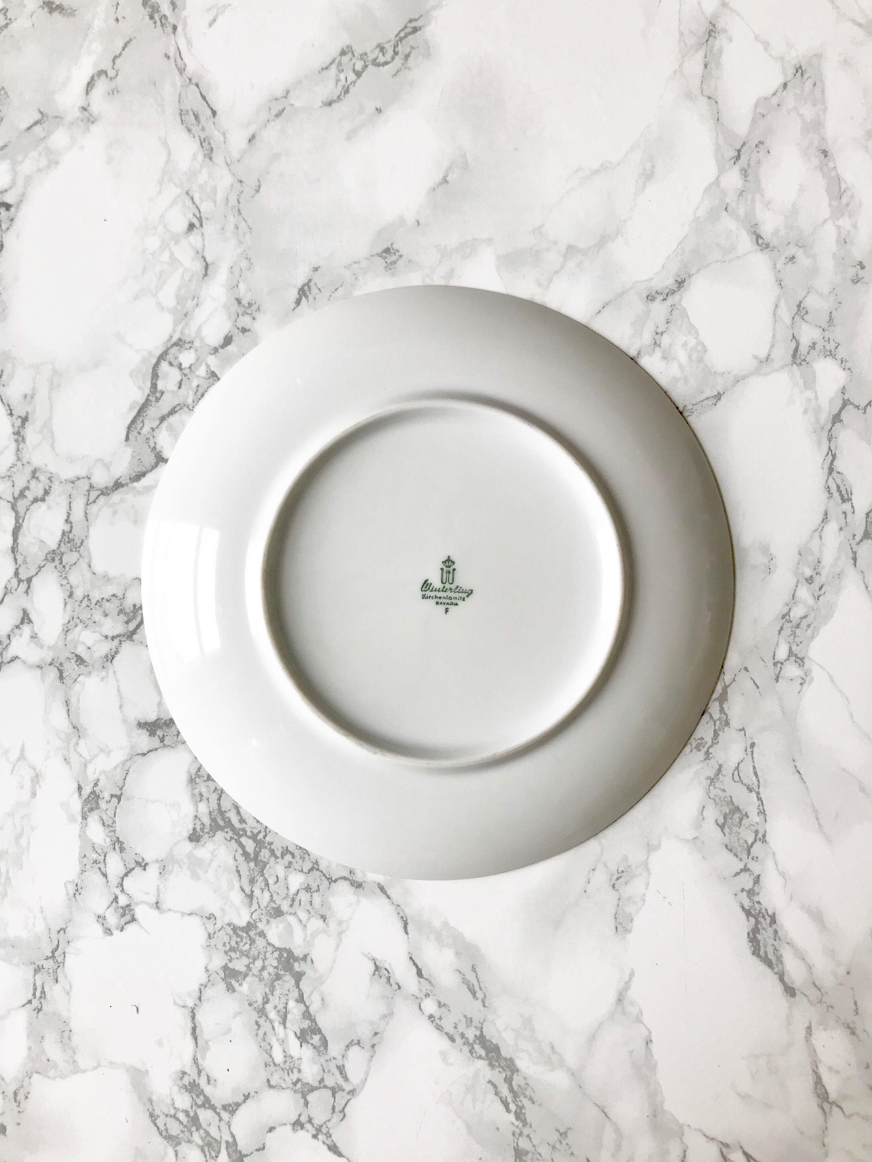 Six white and gold porcelain dessert plates