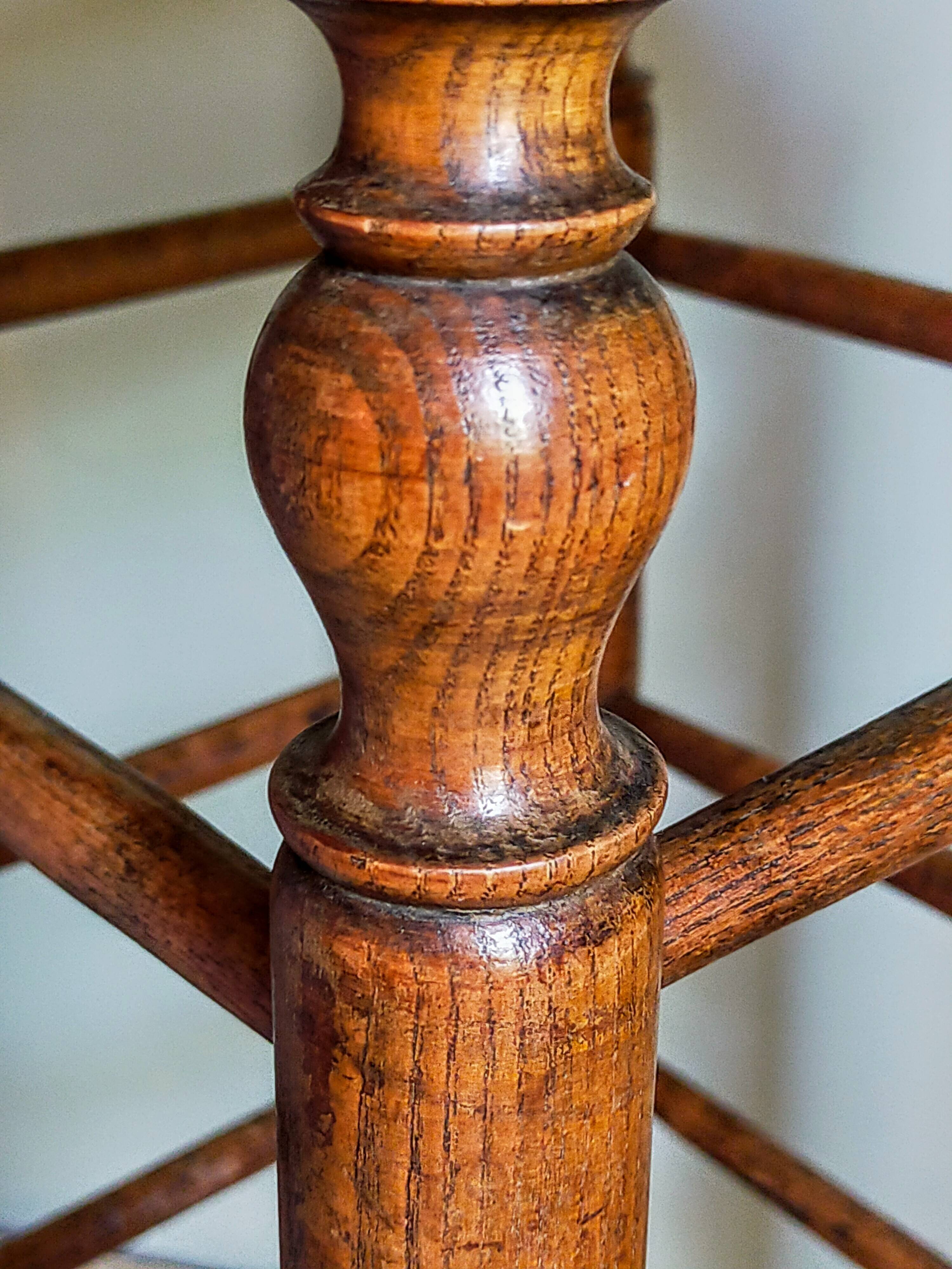 Antique stool with cane and turned wood