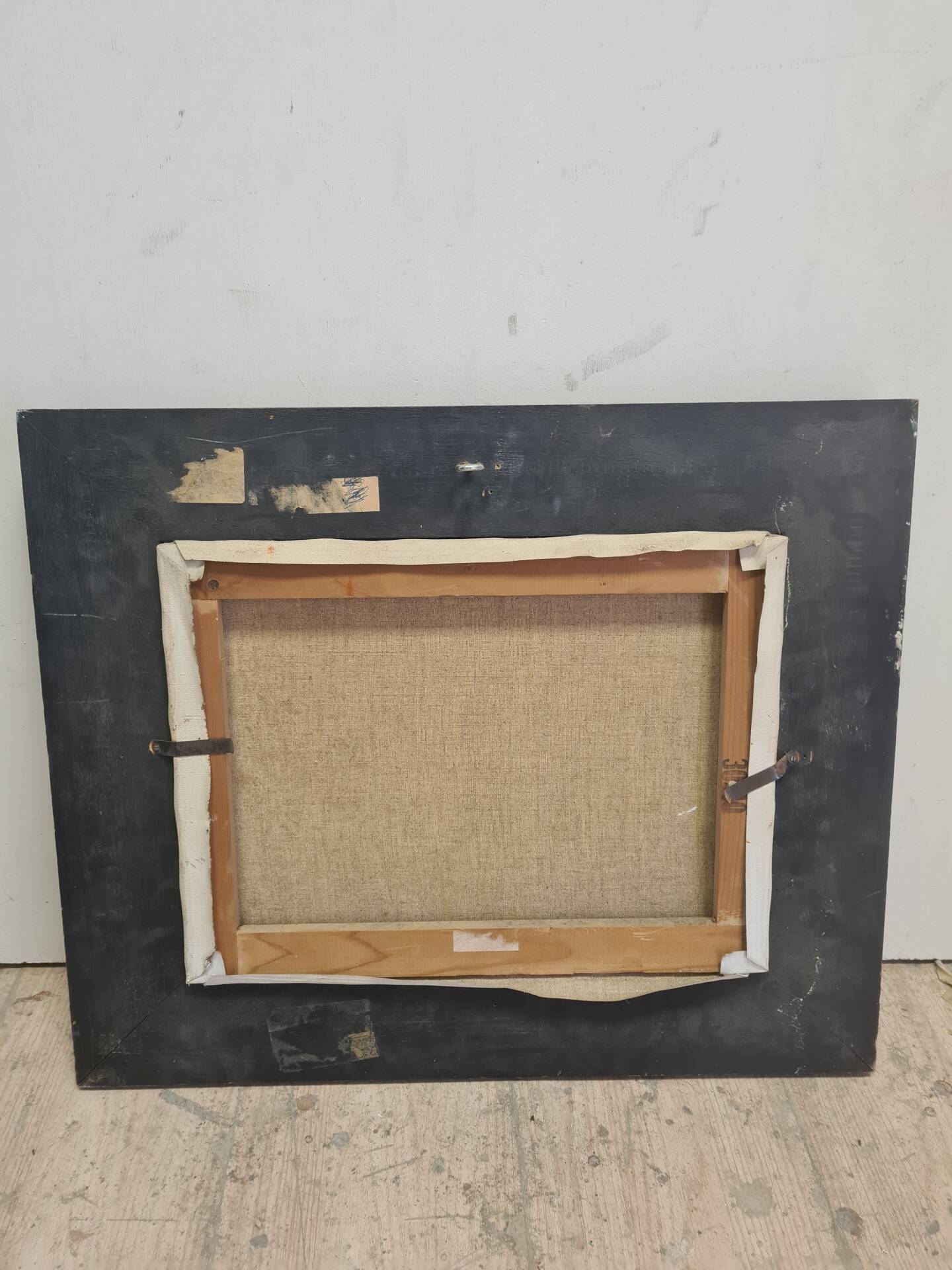 Landscape painting with a wooden frame