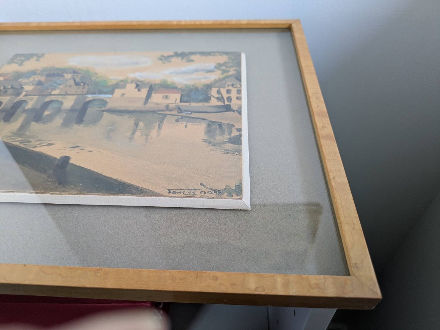 Watercolour signed 1949 framed with a magnifying glass.