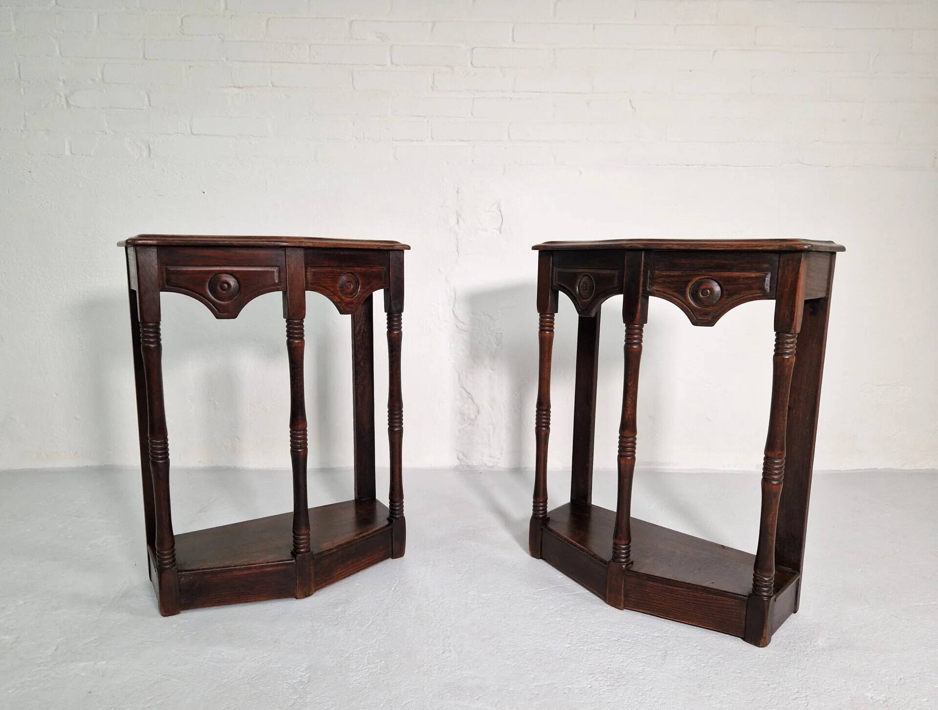 Pair of English 1920s carved oak sidetables