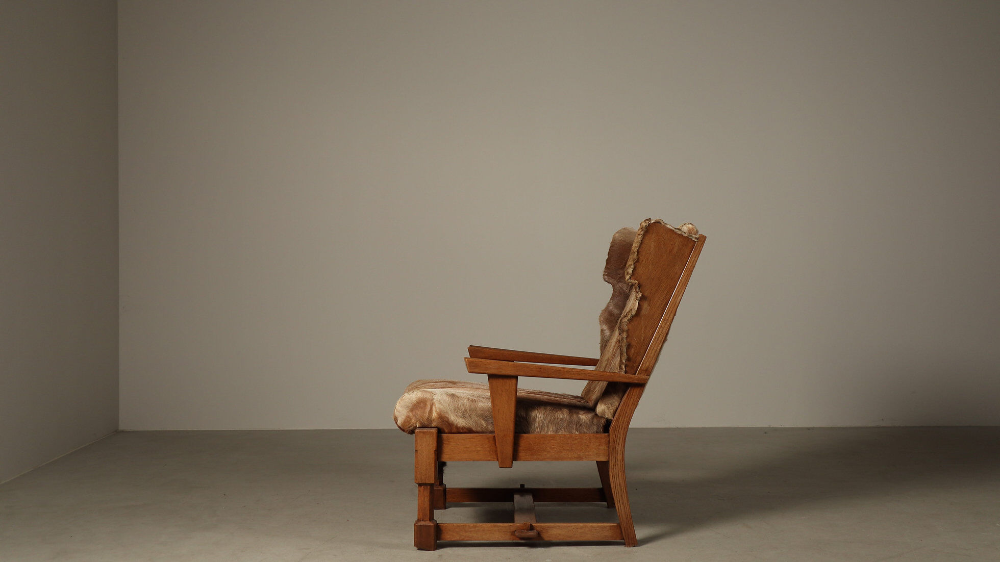 Brutalist oak lounge chair and ottoman in original goat hide, 1960s