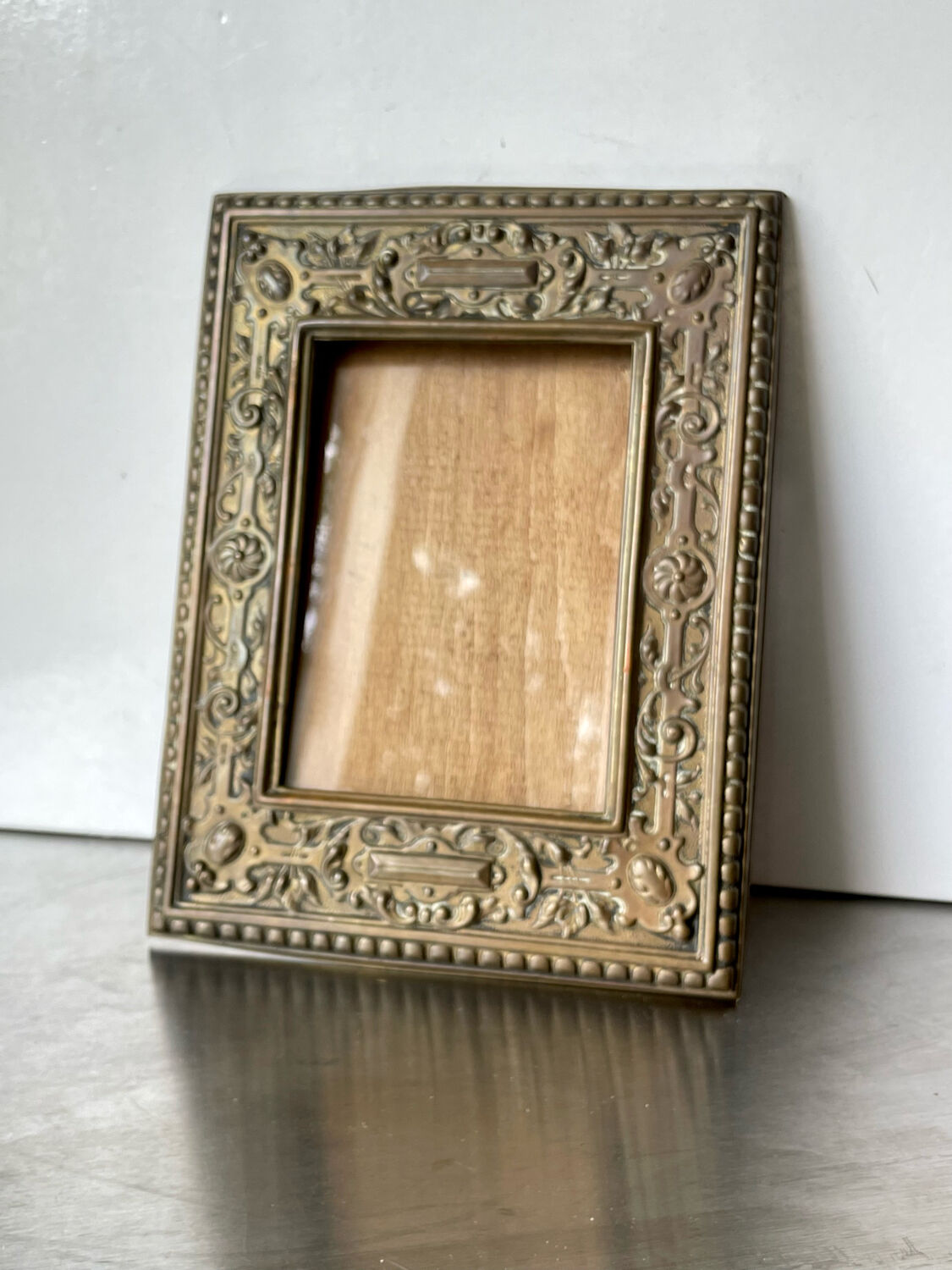 Antique brass metal picture frame in baroque style