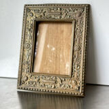 Antique brass metal picture frame in baroque style