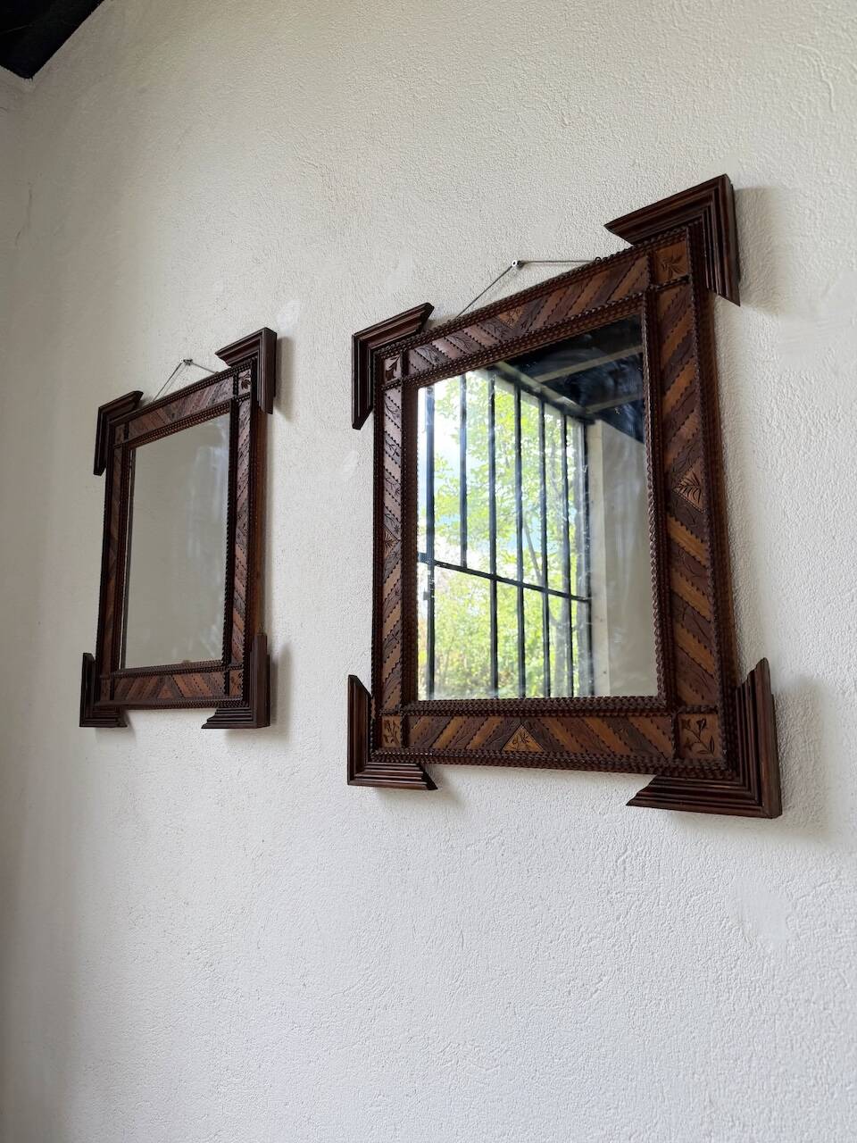 Pair of wooden mirrors in tramp art style