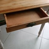 Antique wooden desk with a patinated base