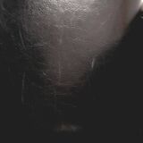 Fauteuil en skaï noir, années 1960