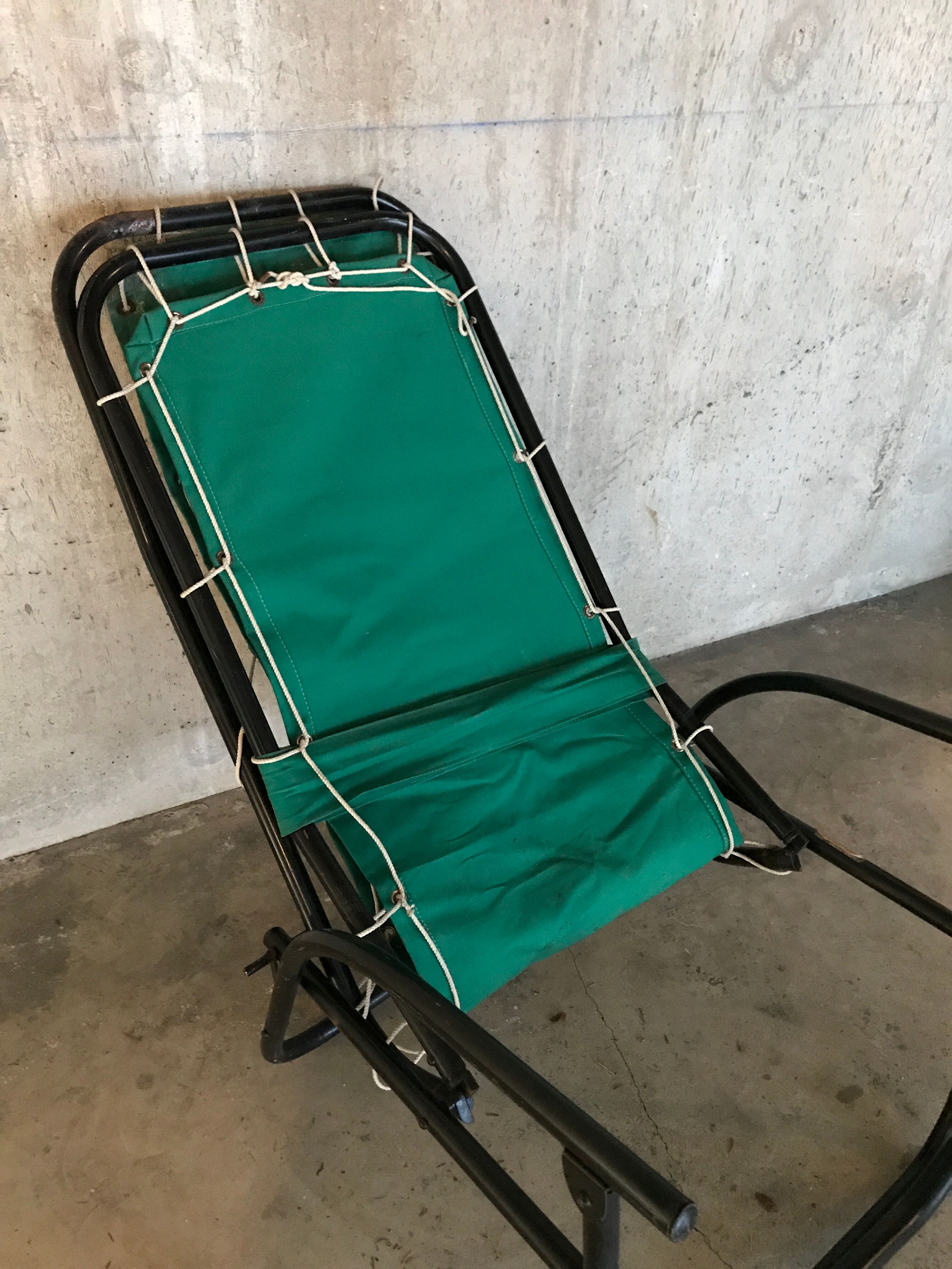 Green fabric and black metal tube long chair