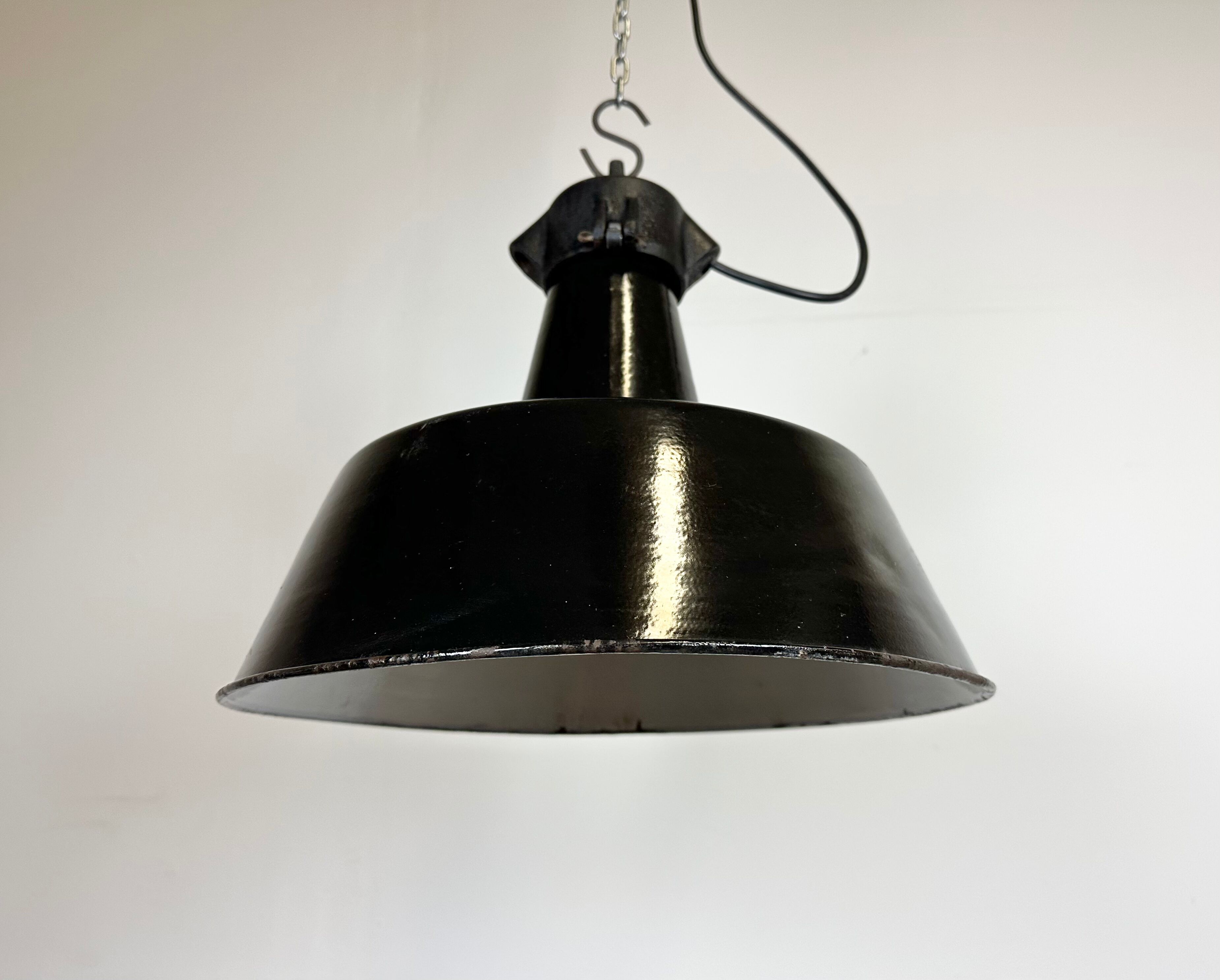 Industrial black enamel factory lamp with cast iron top, 1960s