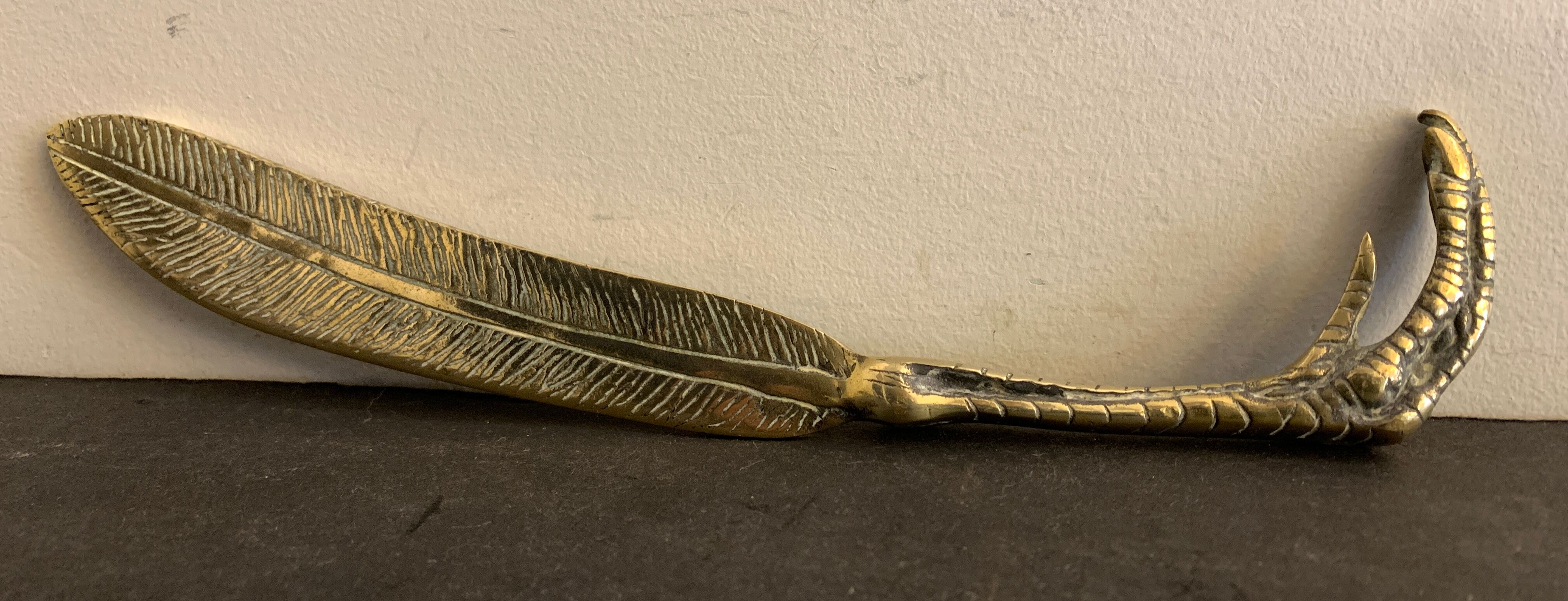 Paper cup or old bronze letter opener, eagle claw shape