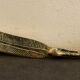 Paper cup or old bronze letter opener, eagle claw shape