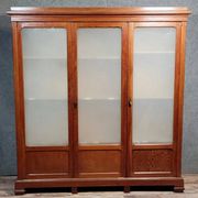 Large pine bookcase with three doors, fitted with frosted glass.