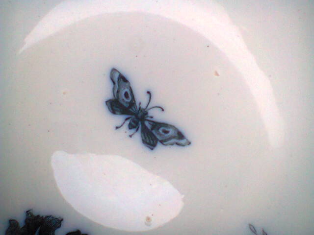Ramekin in earthenware with decoration of flowers, butterflies and birds