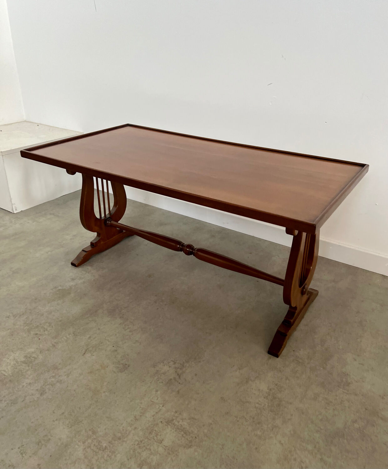 Old rectangular wood coffee table with lyre side posts