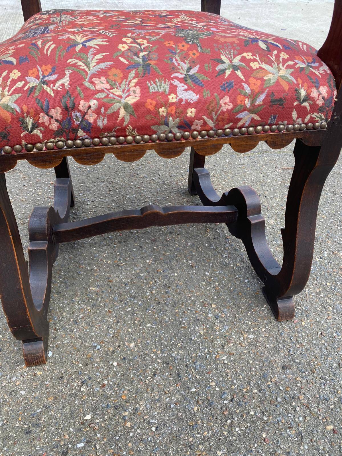 Henri II armchair in solid wood and floral burgundy fabric, 19th century.