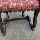 Henri II armchair in solid wood and floral burgundy fabric, 19th century.