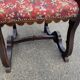 Henri II armchair in solid wood and floral burgundy fabric, 19th century.