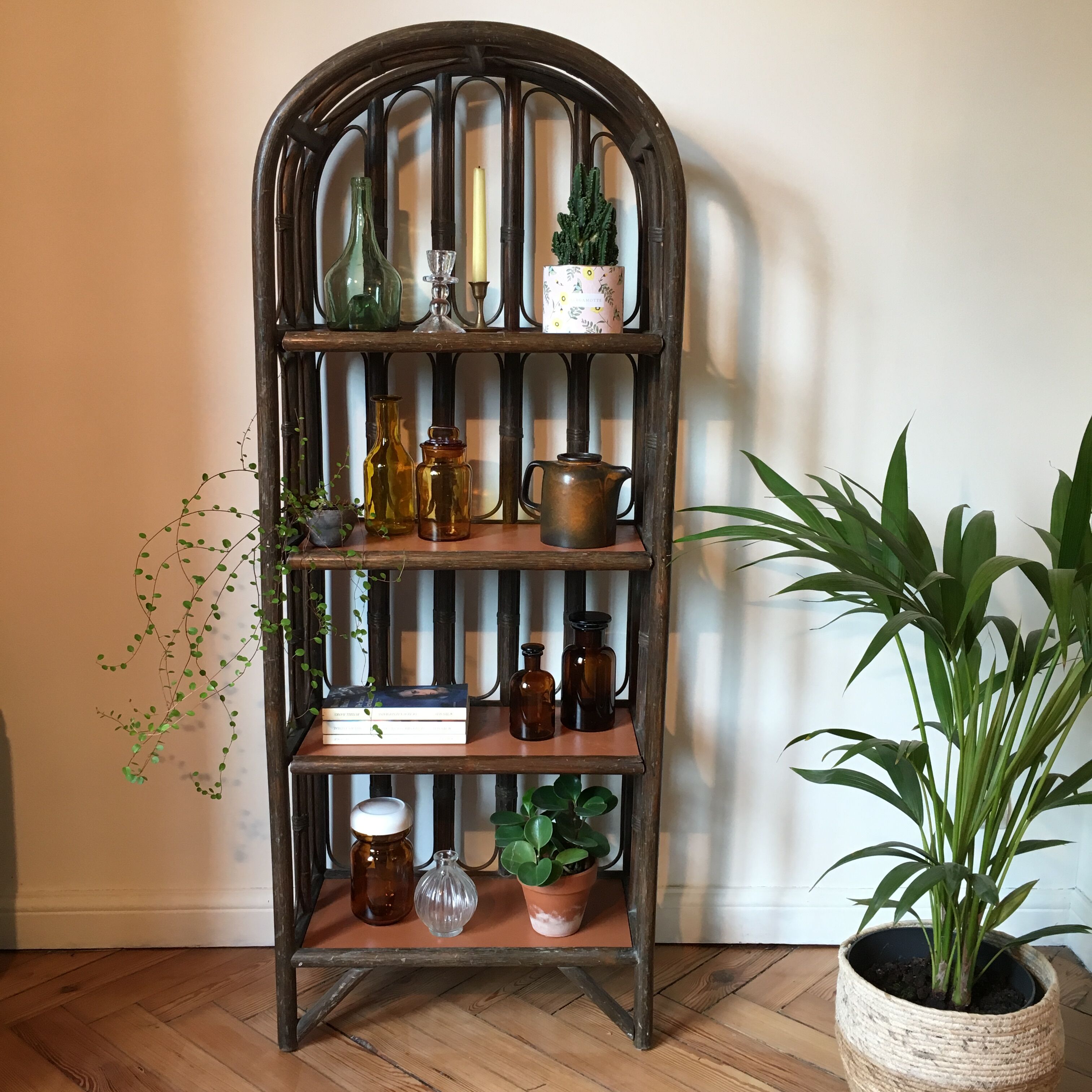 Vintage rattan library and terracotta-coloured tablets