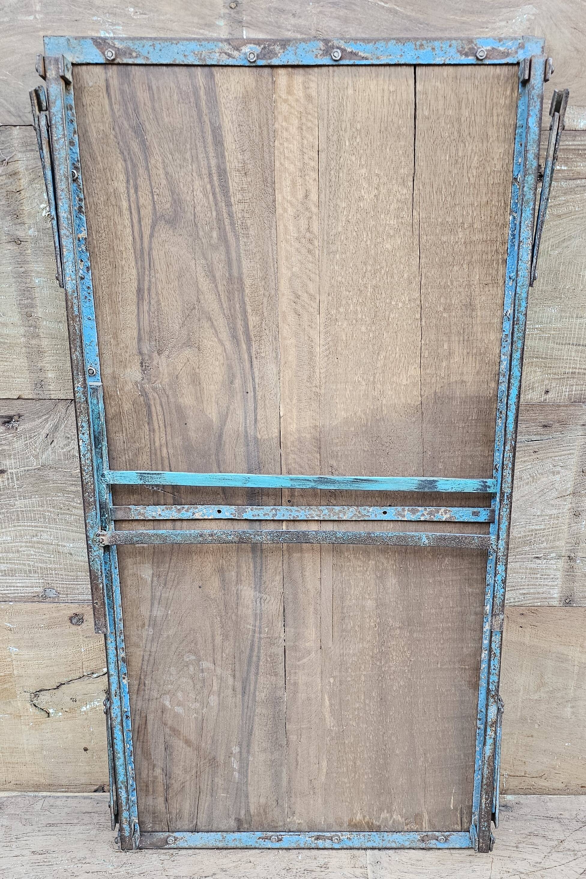 Old folding table in Burmese teak and steel