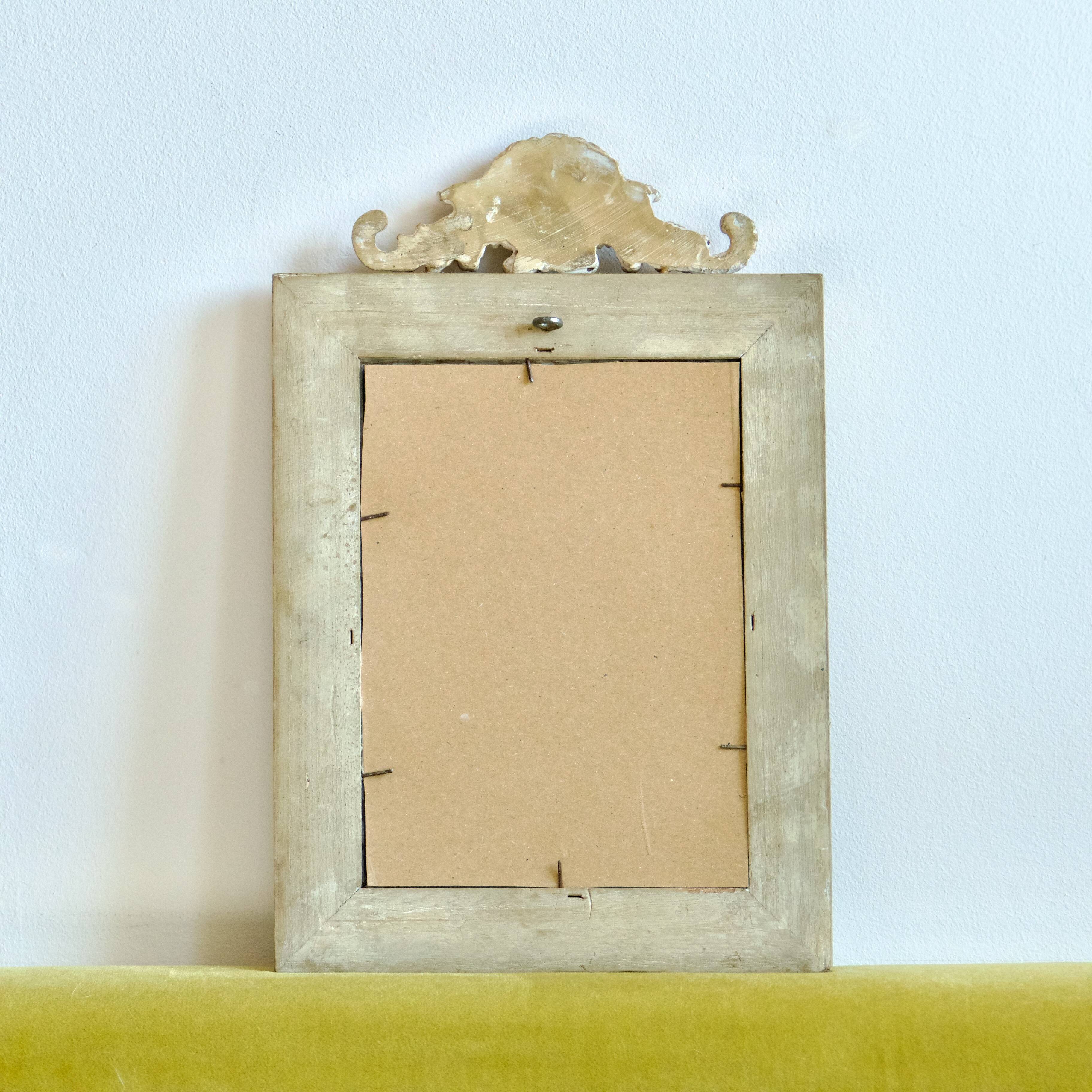 Antique gilded shell mirror with arabesque moldings