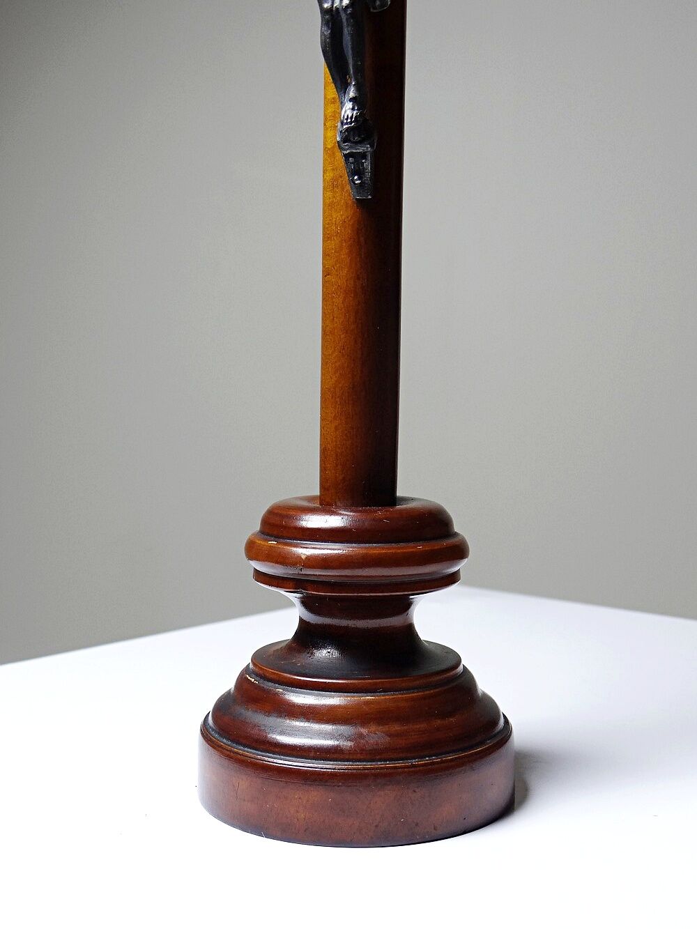 Antique wooden altar crucifix with a turned design and silver-plated Christ.