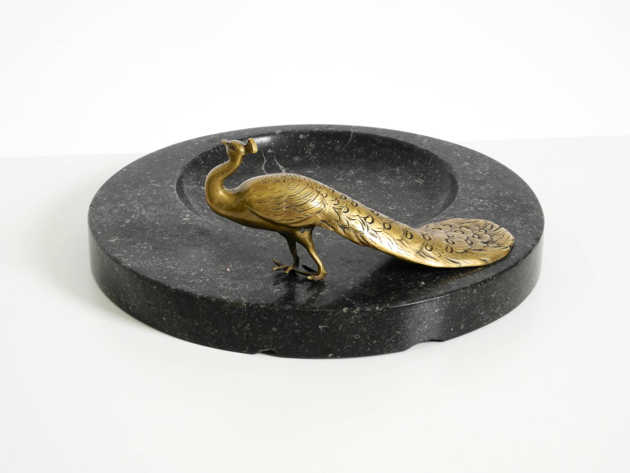 Beautiful, large black granite valet tray featuring a brass peacock, circa