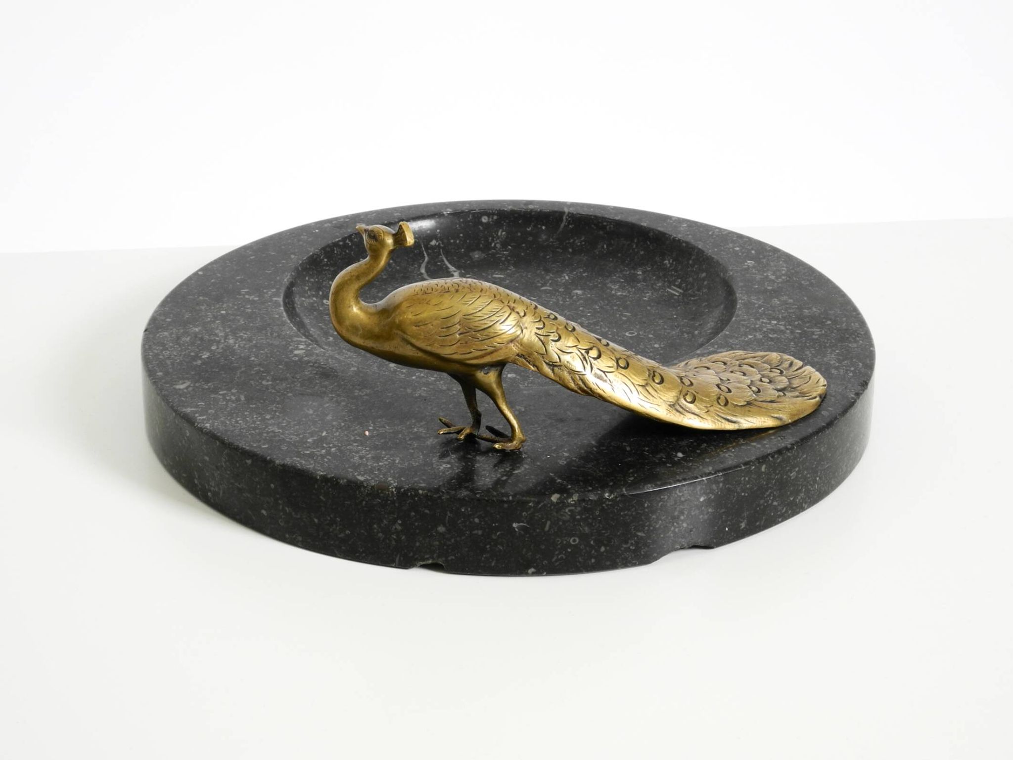 Beautiful, large black granite valet tray featuring a brass peacock, circa