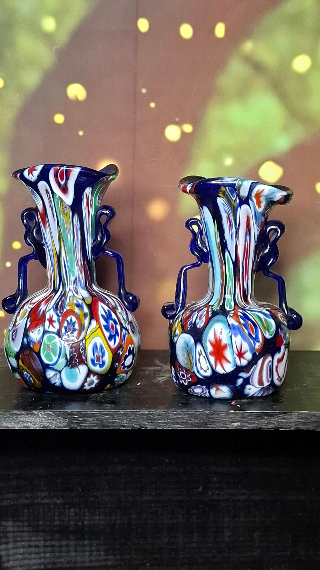 Pair of antique millefiori glass vases attributed to Murano with 2 handles.
