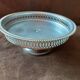 Old metal bowl on foot