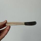 Pink bakelite butter knives.